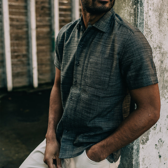fit model posing outdoors in The Short Sleeve Hawthorne in Navy Wave