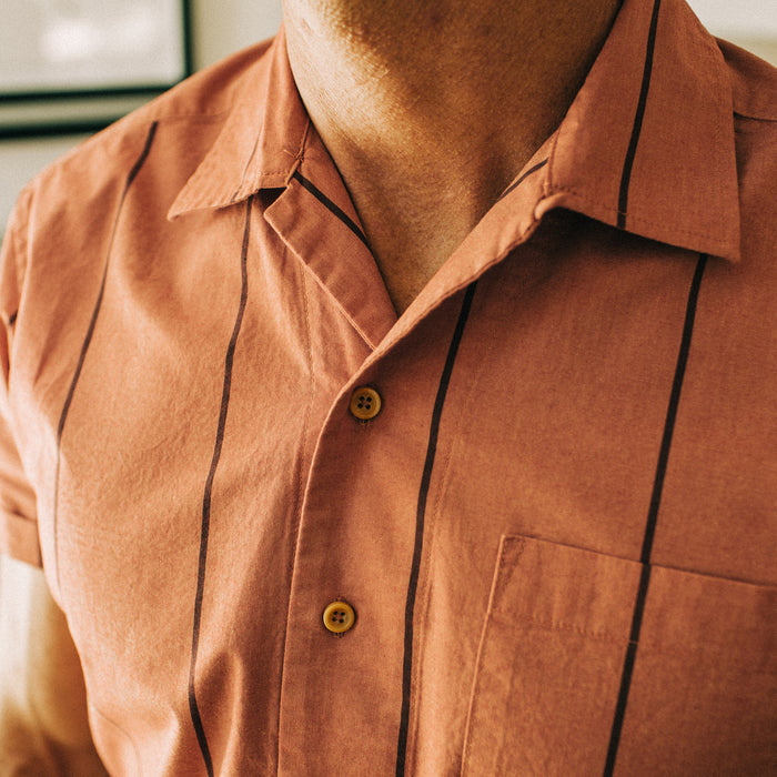 fit model wearing The Short Sleeve Hawthorne in Rust Stripe