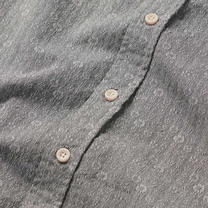 material shot of the buttons on The Short Sleeve Jack in Ash Floral