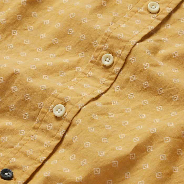 material shot of the buttons on The Short Sleeve Jack in Gold Diamond