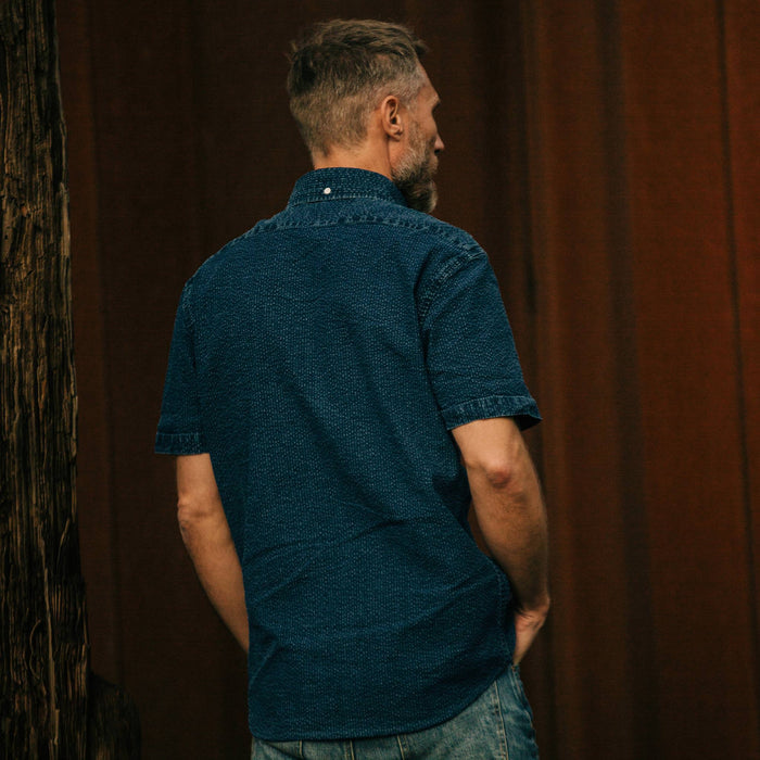 fit model wearing The Short Sleeve Jack in Indigo Seersucker, shown from the back