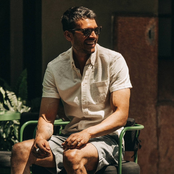 fit model wearing flatlay of The Short Sleeve Jack in Natural Ramie Grid, smiling, looking right