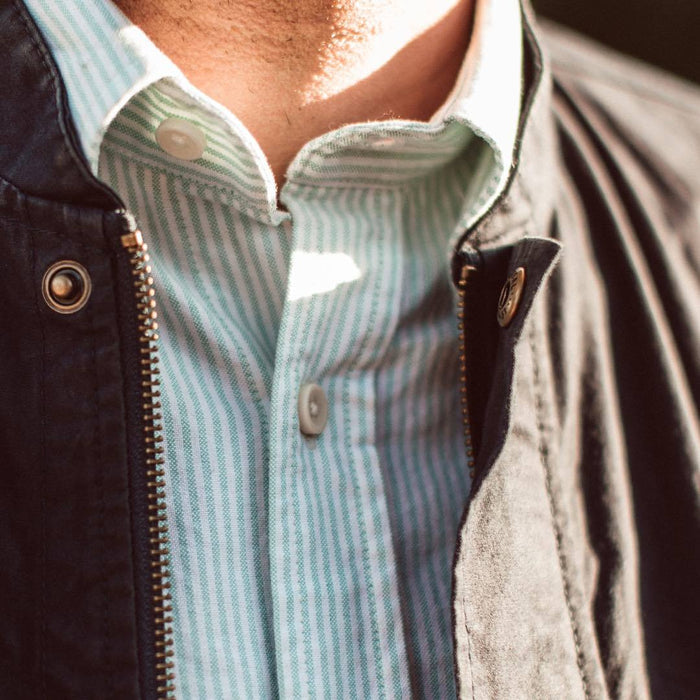 Our fit model wearing The Short Sleeve Jack in Teal University Stripe from Taylor Stitch.