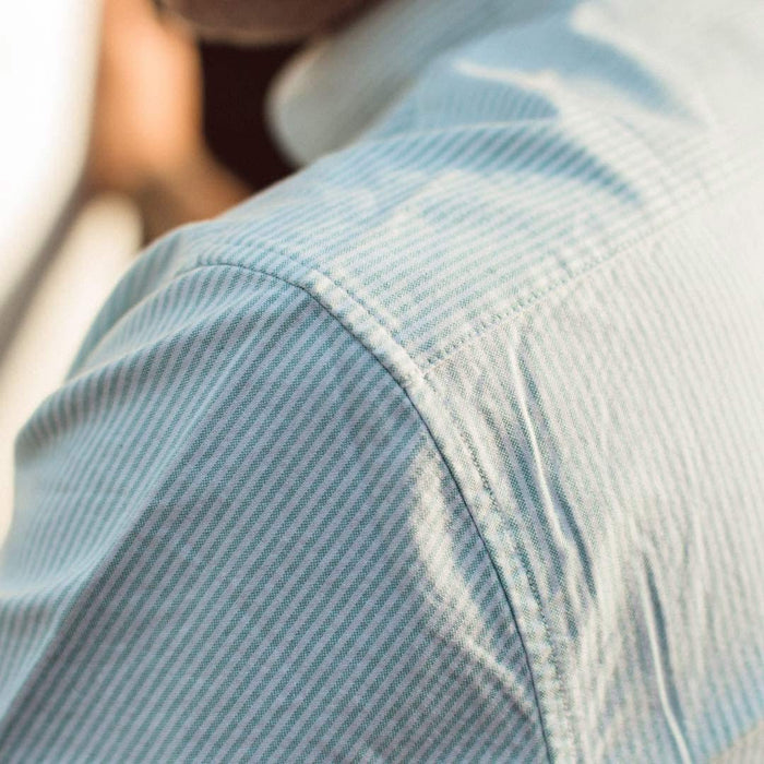 Our fit model wearing The Short Sleeve Jack in Teal University Stripe from Taylor Stitch.