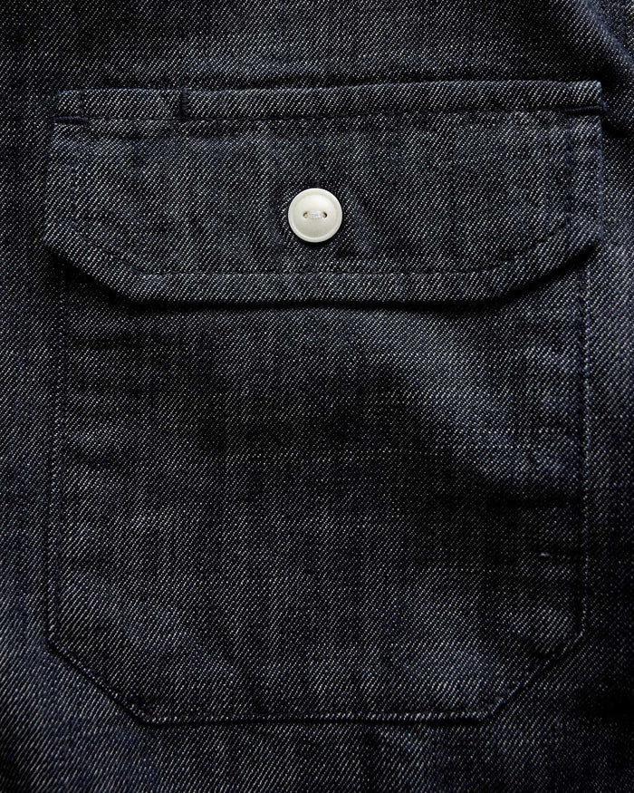 material shot of the pocket on The Short Sleeve Mechanic Shirt in Rinsed Indigo Denim