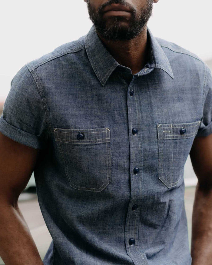 fit model posing in The Short Sleeve Utility Shirt in Indigo Selvedge Chambray