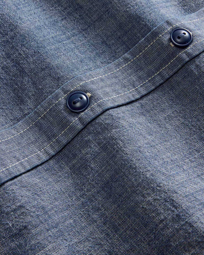 material shot of the buttons on The Short Sleeve Utility Shirt in Indigo Selvedge Chambray