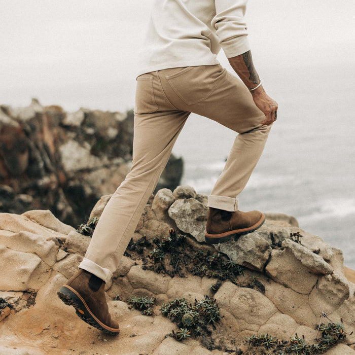 fit model walking on rocks in The Slim All Day Pant in Light Khaki Broken Twill