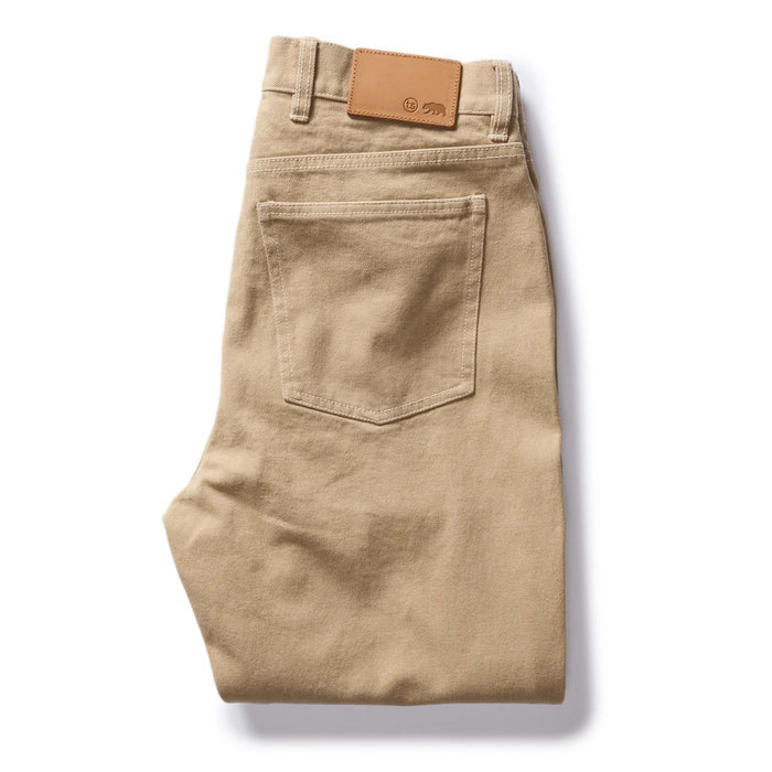 flatlay of The Slim All Day Pant in Light Khaki Broken Twill, folded from back