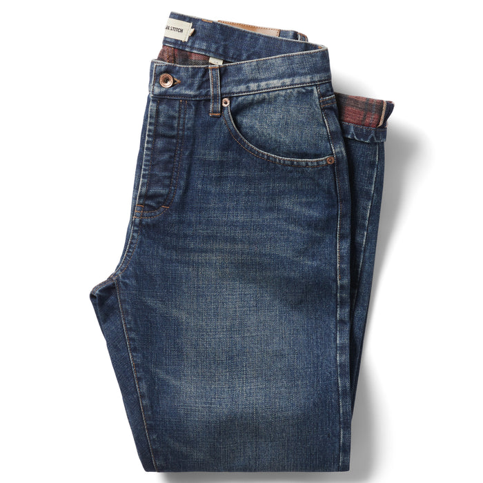 flatlay of The Slim Brushed Back Jean in Sawyer Wash Organic Selvage folded