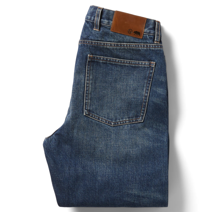 flatlay of the back of The Slim Brushed Back Jean in Sawyer Wash Organic Selvage folded