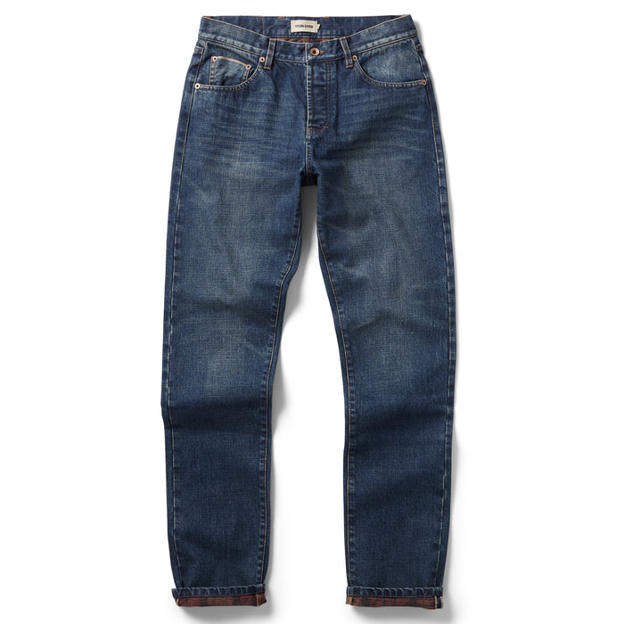 flatlay of The Slim Brushed Back Jean in Sawyer Wash Organic Selvage