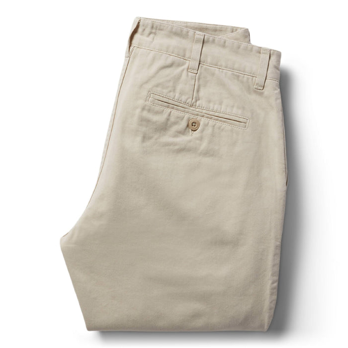 folded flatlay of The Slim Foundation Pant in Organic Stone from the back