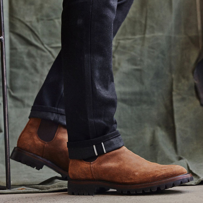 fit model showing the selvedge cuff on The Slim Jean in Black Nihon Menpu Selvage