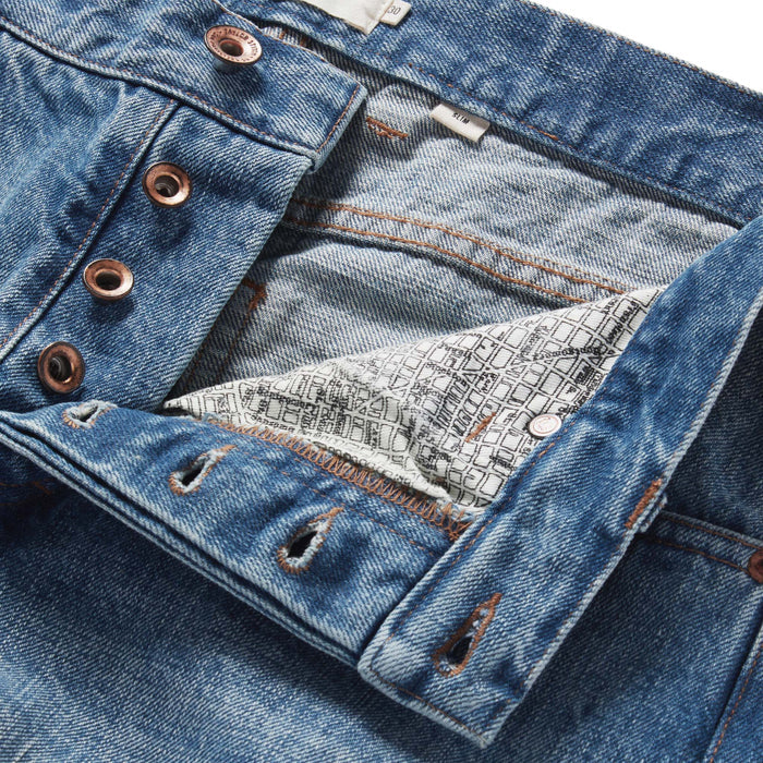 material shot of the button fly on The Slim Jean in Fletcher Wash Organic Selvage
