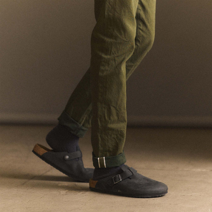 fit model showing selvage cuffs on The Slim Jean in Olive Nihon Menpu Selvage