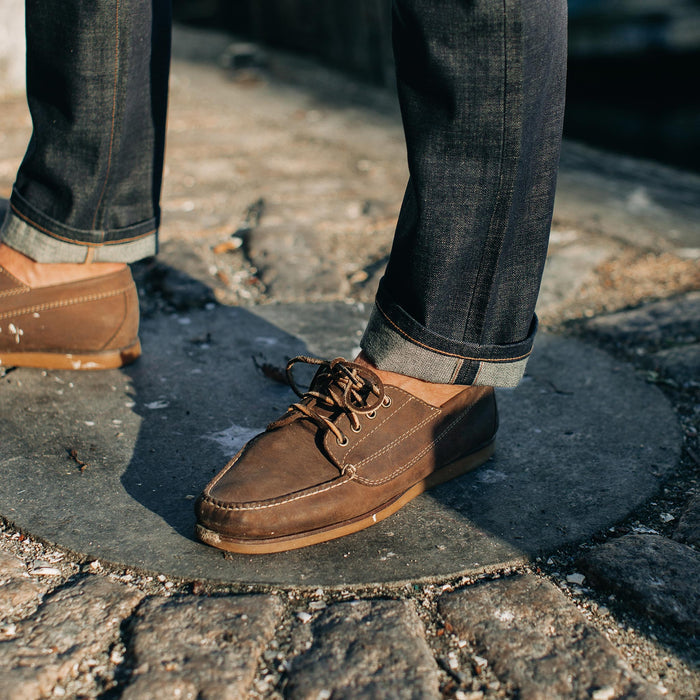 fit model wearing The Slim Jean in Organic Selvage, cuffed with shoes