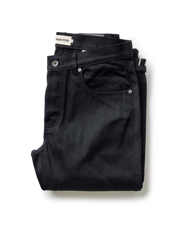 folded flatlay of The Slim Jean in Rigid Black Organic Selvedge