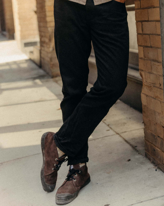 fit model cuffing The Slim Jean in Rigid Black Organic Selvedge