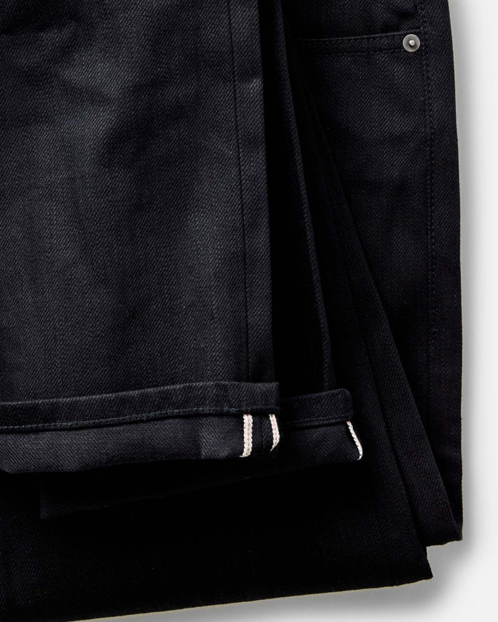 material shot of the waistband on The Slim Jean in Rigid Black Organic Selvedge
