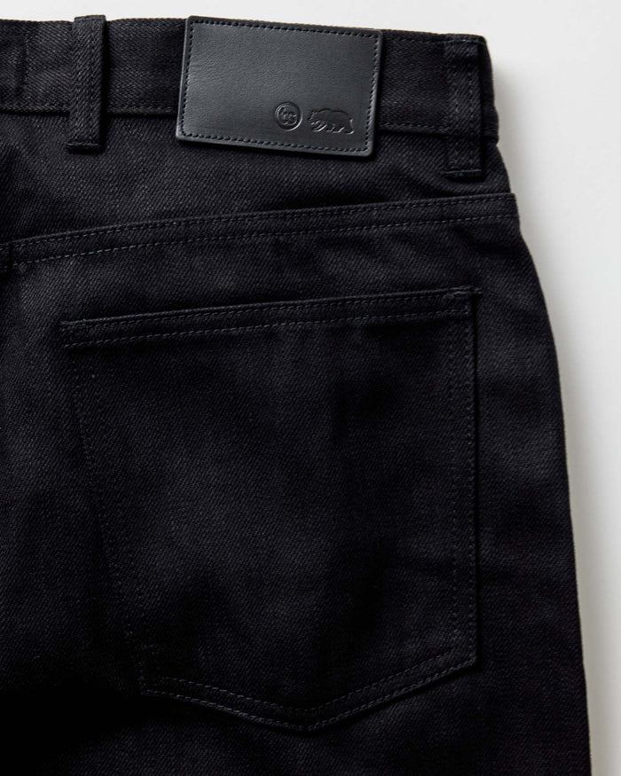 material shot of the button fly on The Slim Jean in Rigid Black Organic Selvedge