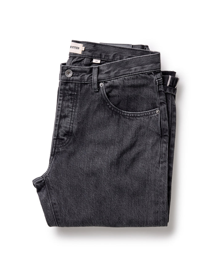 folded flatlay of The Slim Jean in Washed Black Organic Slub Selvedge