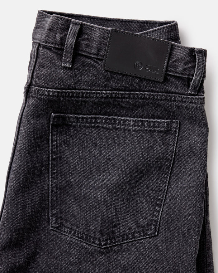 material shot of the back pocket on The Slim Jean in Washed Black Organic Slub Selvedge