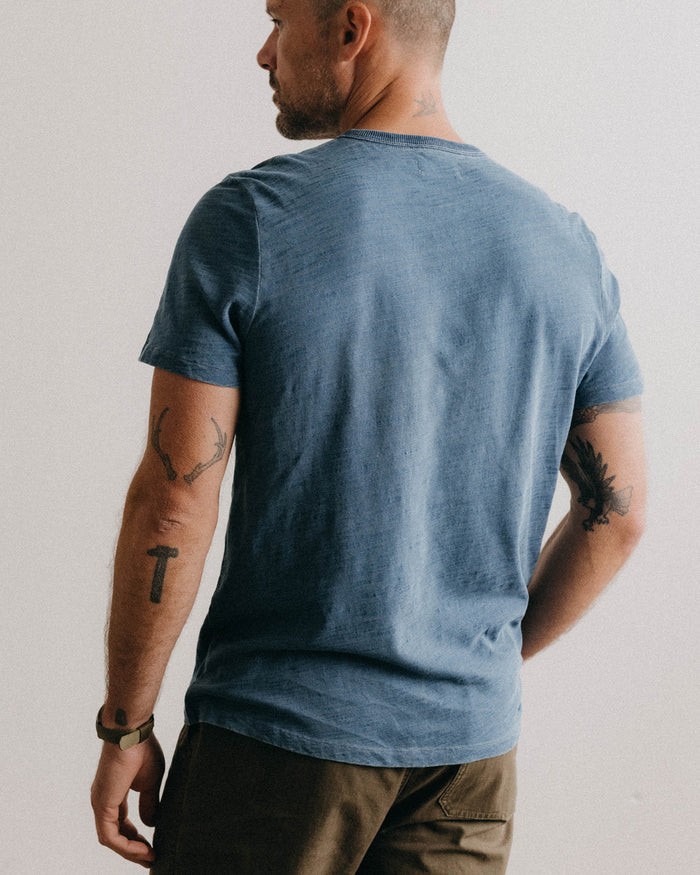 fit model showing off the back of The Organic Cotton Tee in Washed Indigo