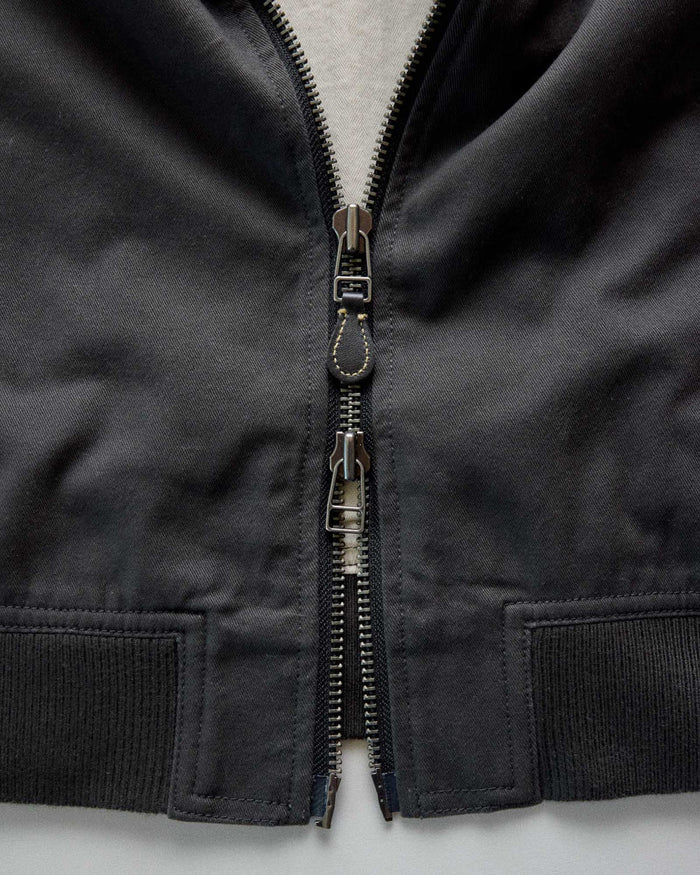 material shot of the zipper on The Speedway Bomber in Organic Faded Black Twill