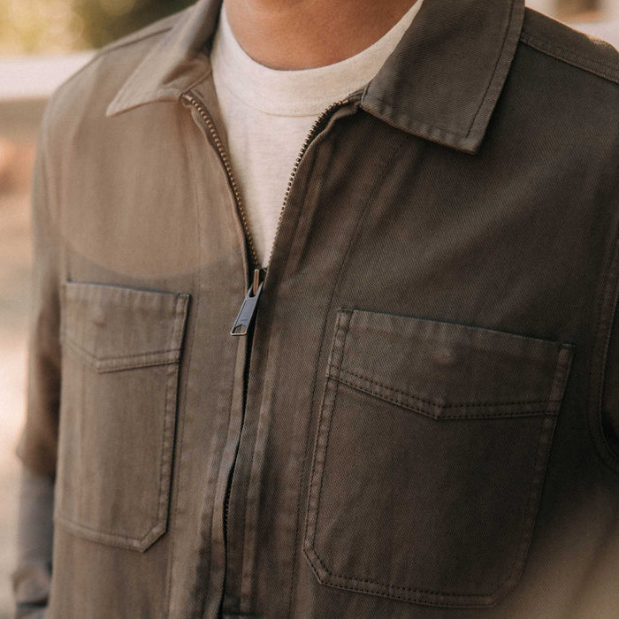 fit model showing off the pockets on The Station Jacket in Fatigue Olive Broken Twill