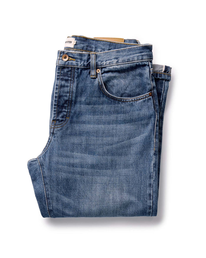 folded flatlay of The Straight Jean in Mid Wash Organic Selvedge