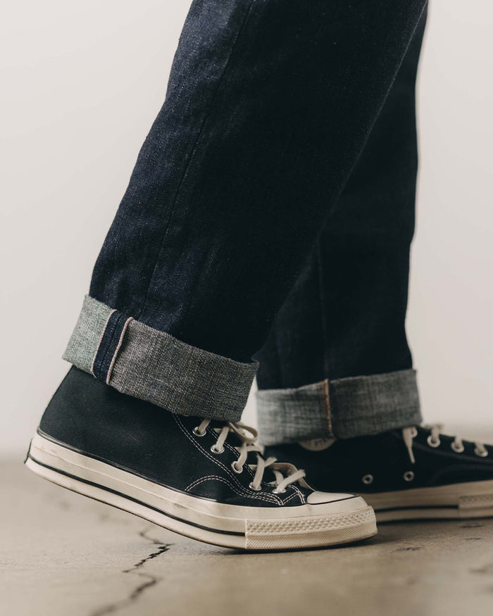 fit model showing off the cuffs on The Straight Jean in Rinsed Yoshiwa Selvedge
