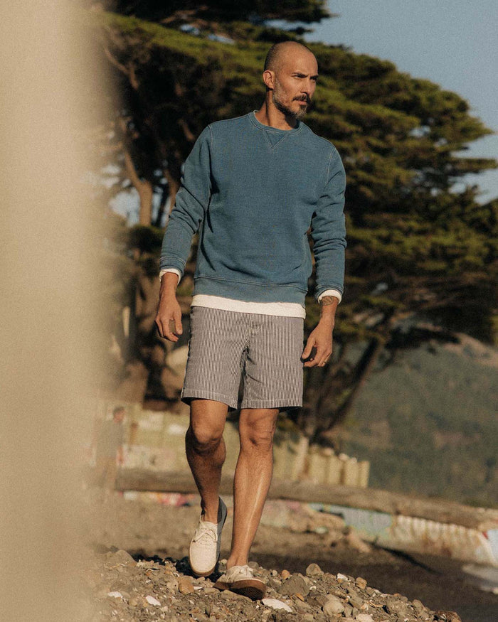 fit model walking wearing The Apres Crew in Washed Indigo Terry