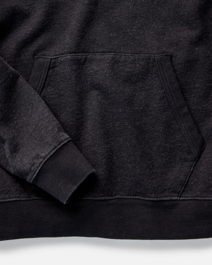 material shot of the hem on The Apres Hoodie in Black Indigo Terry
