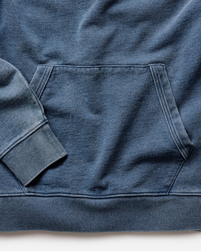material shot of the bottom on The Apres Hoodie in Washed Indigo Terry