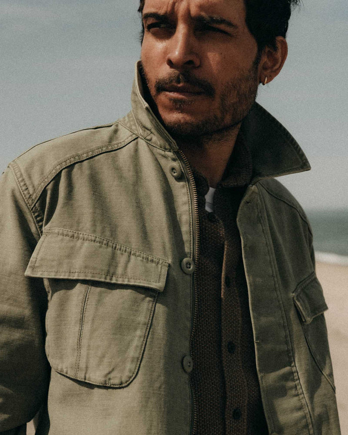 fit model posing in The Surplus Jacket in Field Olive Reverse Sateen