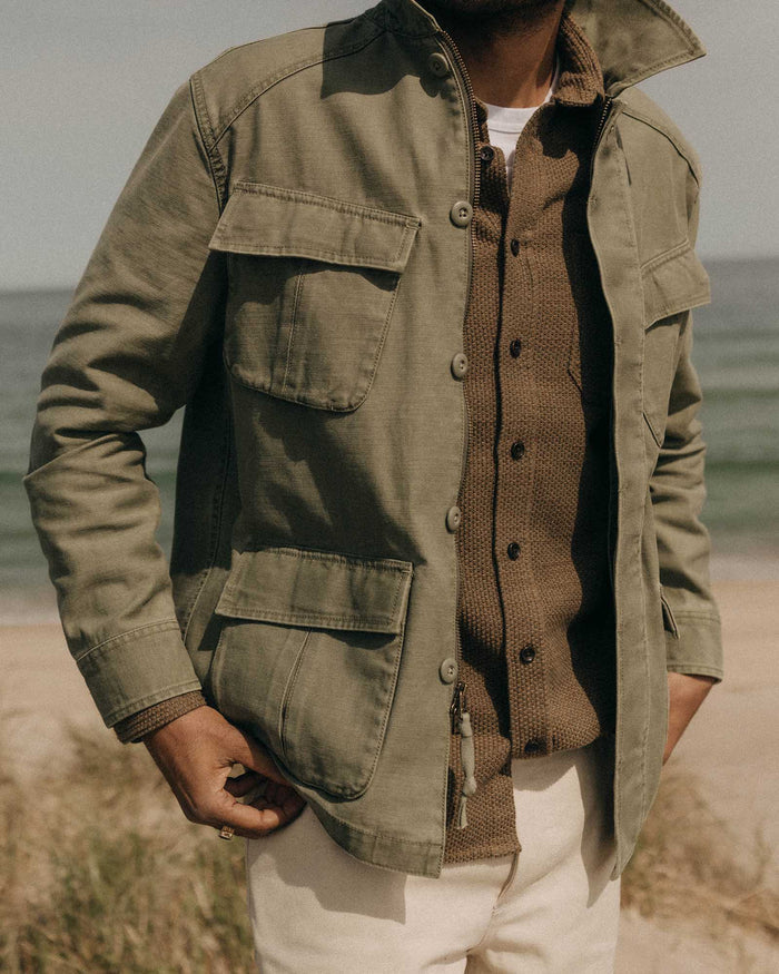 fit model walking wearing The Surplus Jacket in Field Olive Reverse Sateen