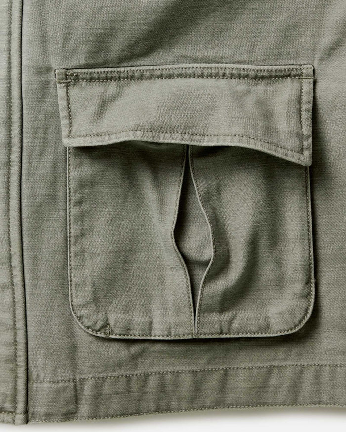 material shot of the pockets on The Surplus Jacket in Field Olive Reverse Sateen