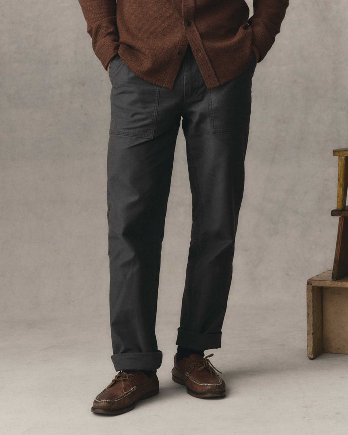 fit model posing in The Surplus Pant in Faded Black Reverse Sateen