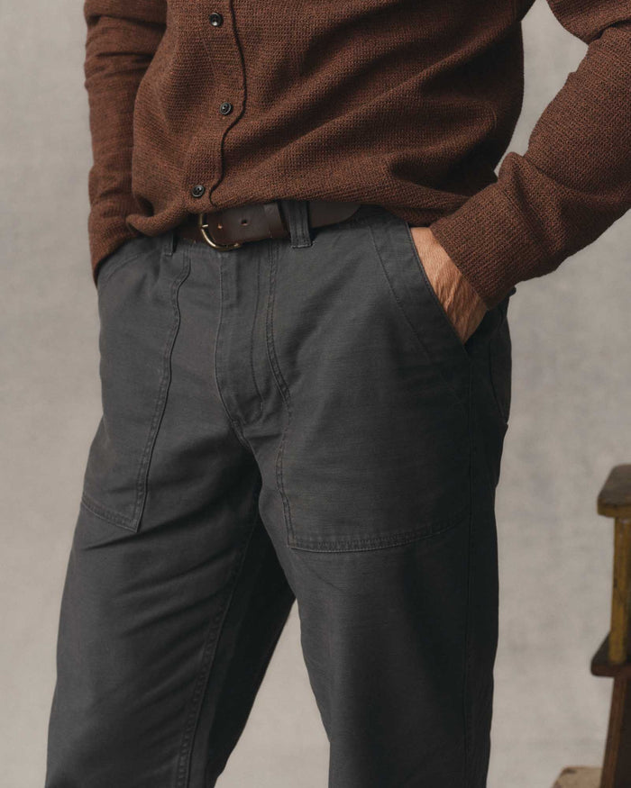 fit model walking wearing The Surplus Pant in Faded Black Reverse Sateen