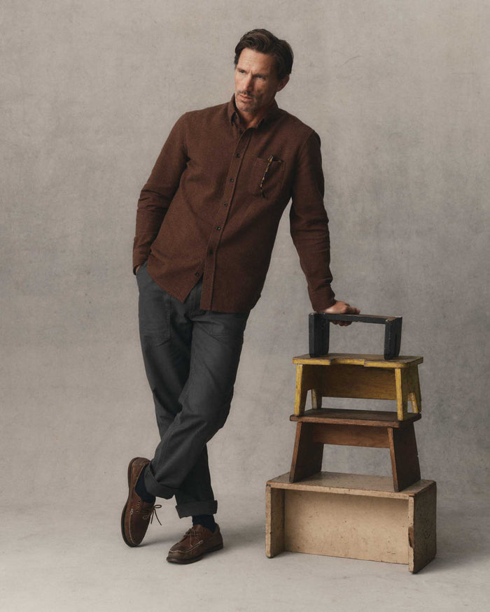 fit model showing off the back pocket on The Surplus Pant in Faded Black Reverse Sateen