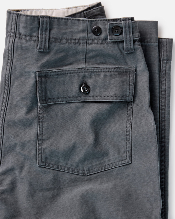 material shot of the back pocket on The Surplus Pant in Faded Black Reverse Sateen