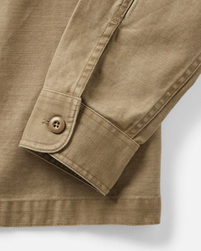 fit model showing off buttons on The Surplus Shirt in Khaki Reverse Sateen
