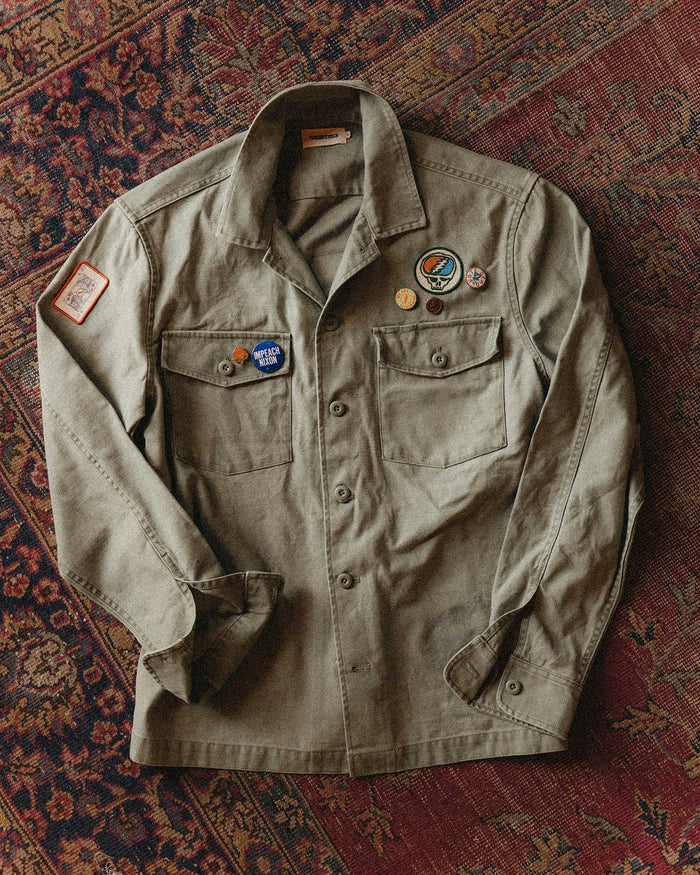 editorial flatlay of The Surplus Shirt in Field Olive Reverse Sateen