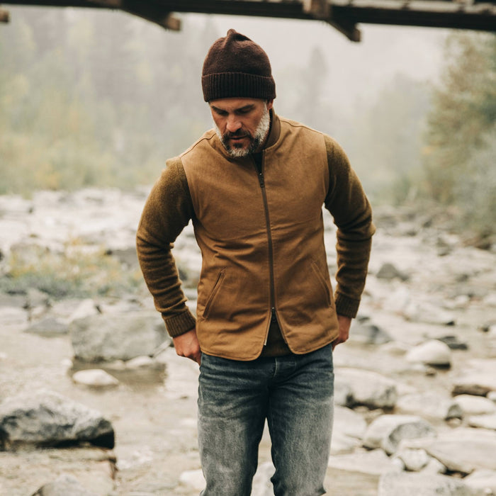 our fit model wearing The Reversible Able Vest in Arid Camo—looking down
