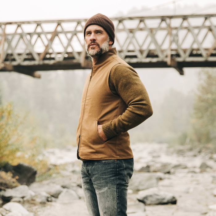 our fit model wearing The Reversible Able Vest in Arid Camo—looking up