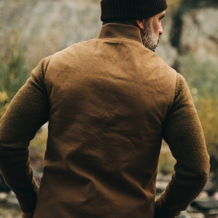 our fit model wearing The Reversible Able Vest in Arid Camo—back shot