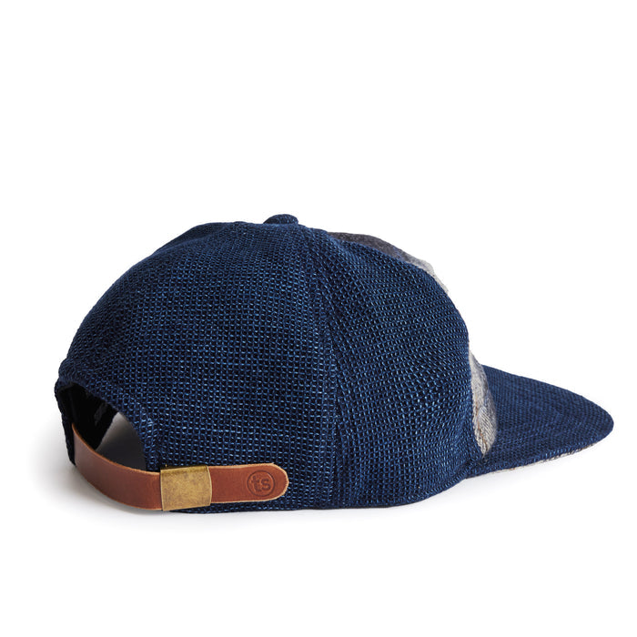 flatlay of the back of a TS x Hypeadelic cap