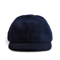 flatlay of the front of a TS x Hypeadelic cap