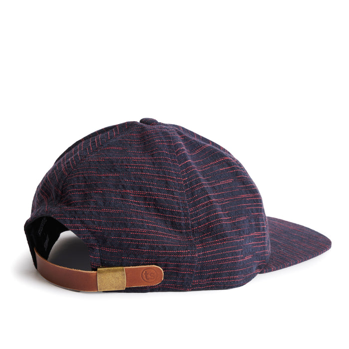 flatlay of the back of a TS x Hypeadelic cap